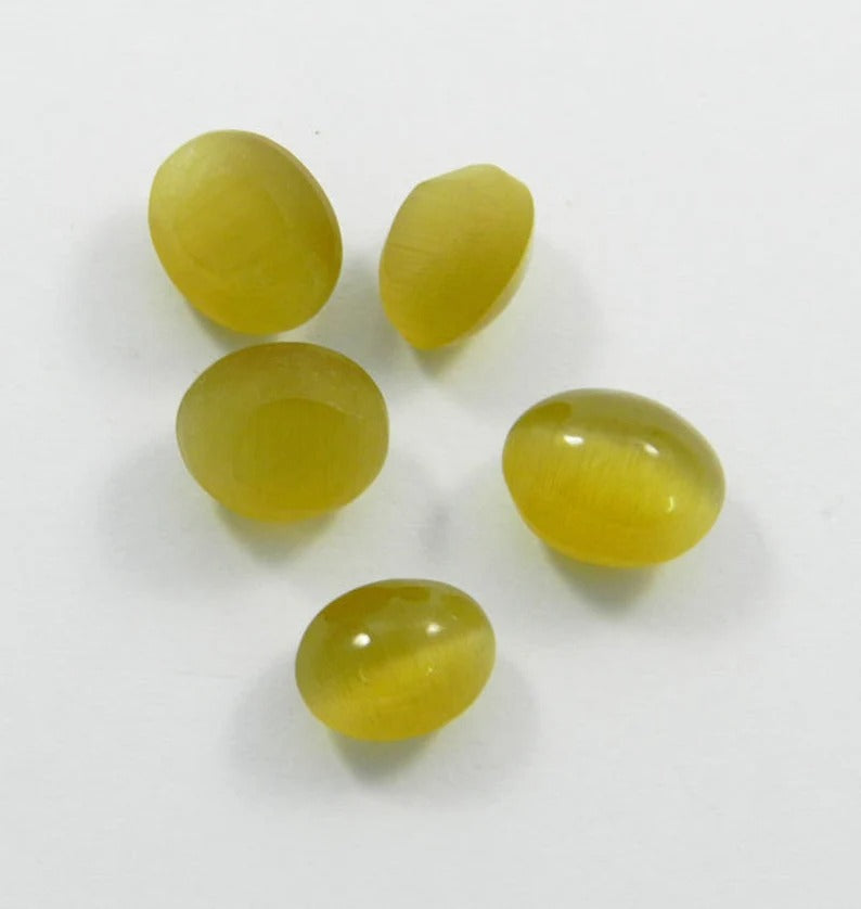 Synthetic yellow cats eye 12 x 9 mm oval cabochon semi precious stone good quality calibrated smooth loose gemstone