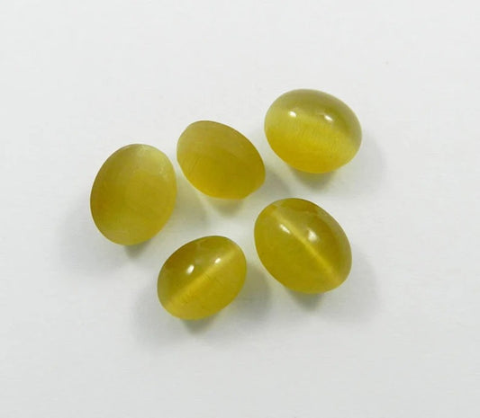 Synthetic yellow cats eye 12 x 9 mm oval cabochon semi precious stone good quality calibrated smooth loose gemstone